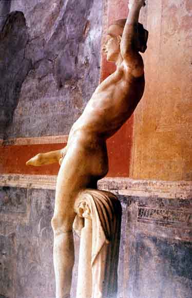 marble statue from a house in ancient pompeii of a muscular young man with enormous erect phallus, which served as the waterspout for a fountain