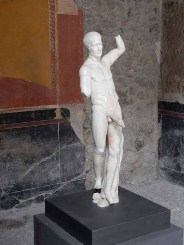 ancient roman marble statue of a muscular youth with prominent erection that served as the waterspout of a fountain